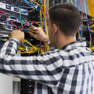 young-man-working-ethernet-switch